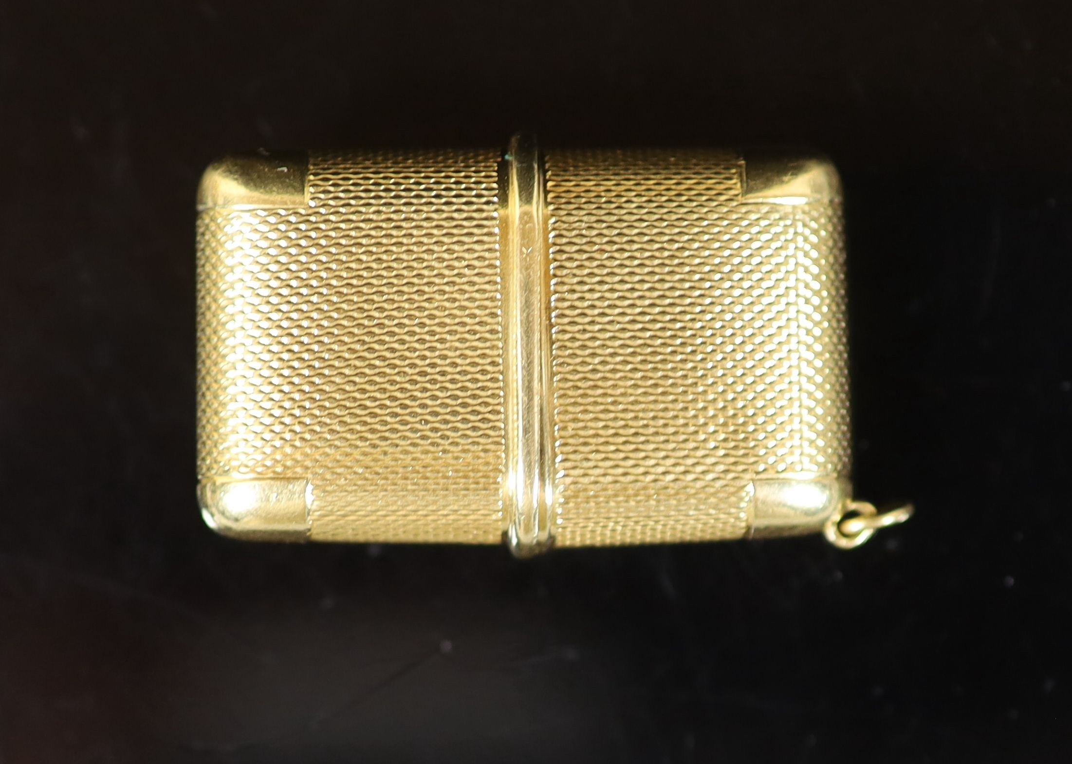 An engine turned 18ct gold cased Movado travelling watch